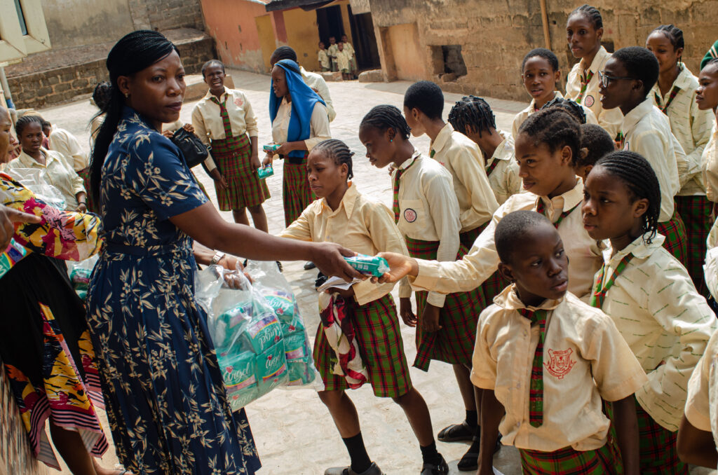 image of a woman giving support to teenage girls